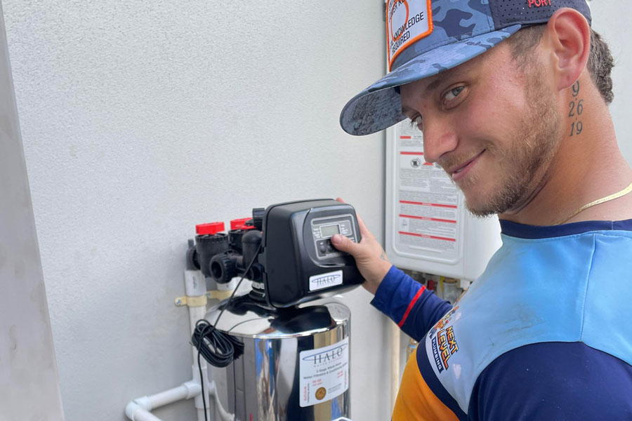 Technician installing a water filtration system.