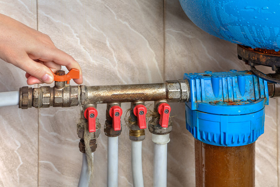 Hand adjusting valve during Water Softener Installation